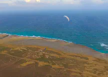 Kitepower 60 m2 kite flying above the shoreline of the Caribbean island Aruba.