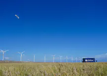 Kitepower Falcon 100 kW AWES operating upwind of the Vader Piet wind farm on the Caribbean island Aruba.